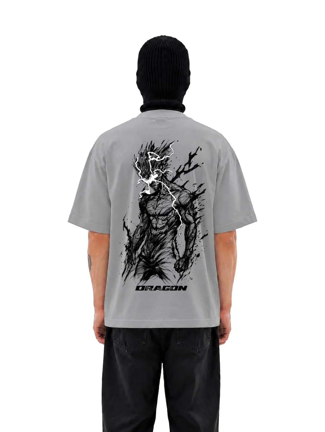 Dragon oversized t-shirt in washed grey, storm-lit figure printed across the back above the Dragon wordmark